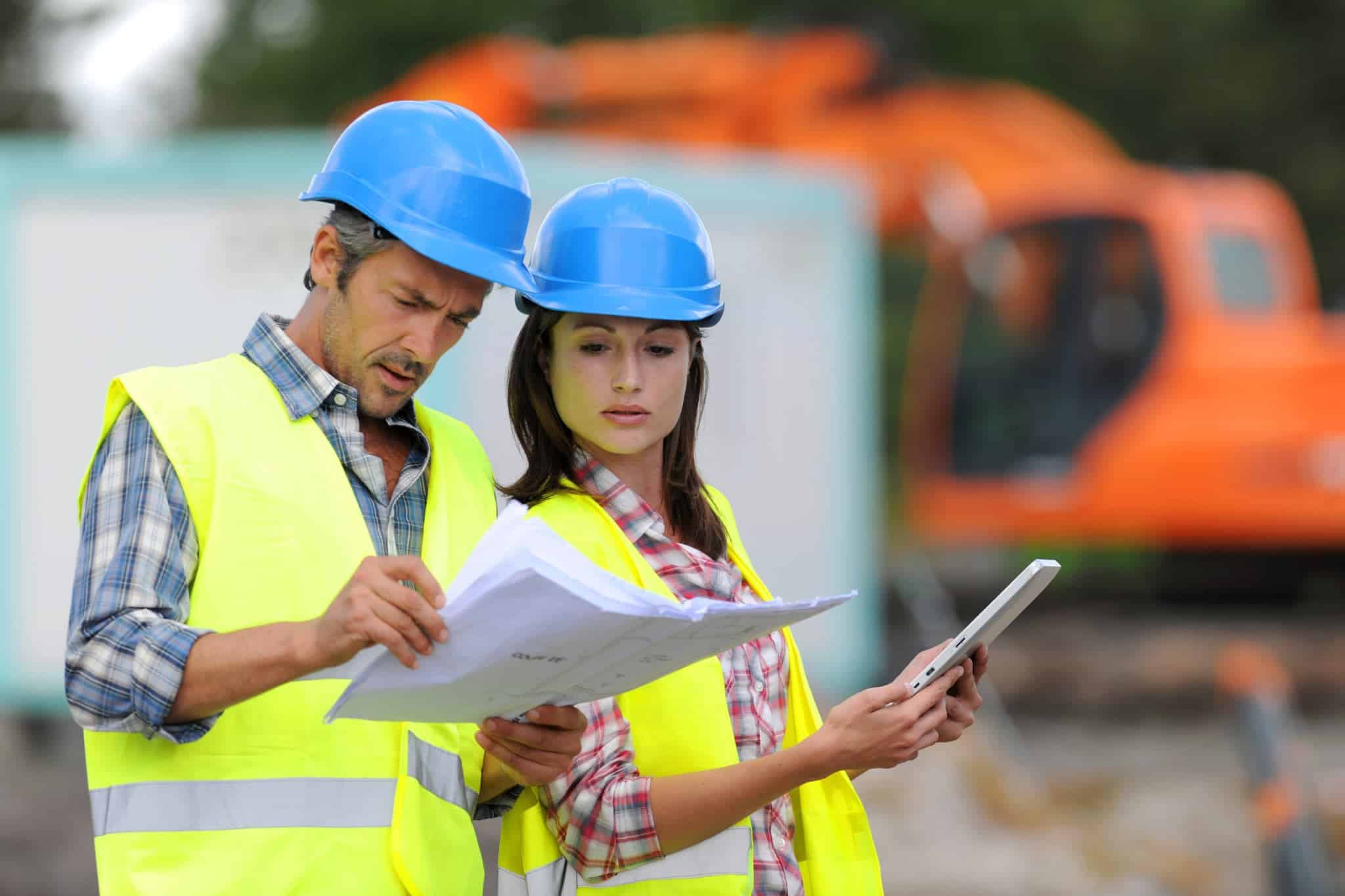 Environmental consultants reviewing plans and technical reports